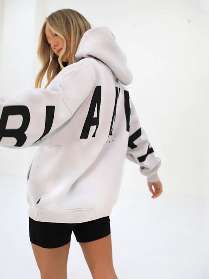 Lovéa - Oversize Kapuzenpullover für Frauen mit auffälligem Textdruck