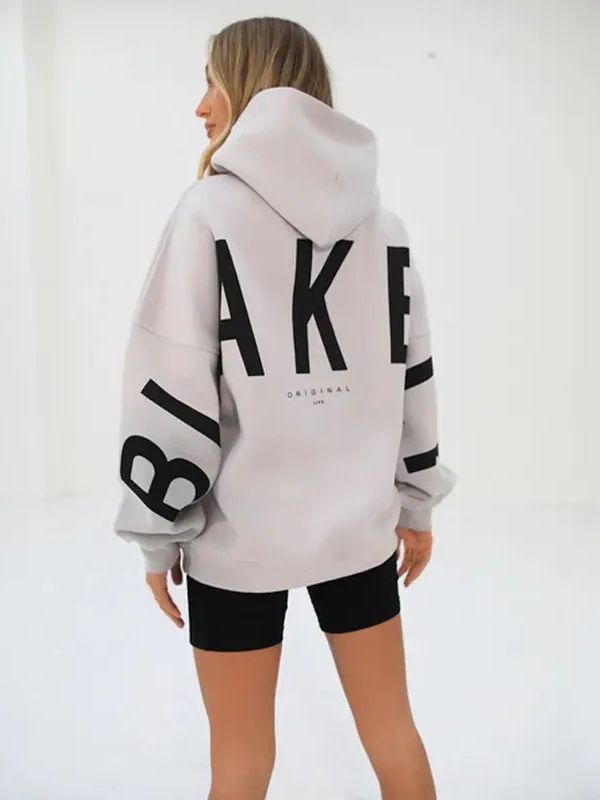 Lovéa - Oversize Kapuzenpullover für Frauen mit auffälligem Textdruck