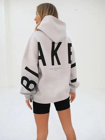 Lovéa - Oversize Kapuzenpullover für Frauen mit auffälligem Textdruck