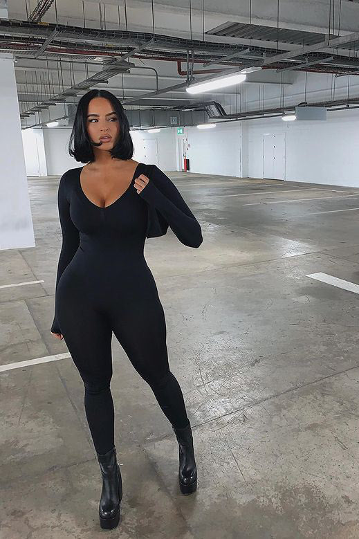 Célindra - Schwarzer Nahtloser Jumpsuit mit Tiefem Ausschnitt und Langen Ärmeln