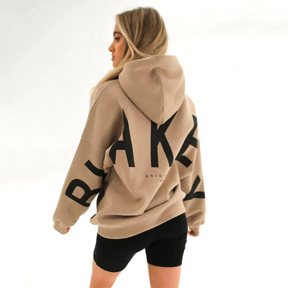 Lovéa - Oversize Kapuzenpullover für Frauen mit auffälligem Textdruck