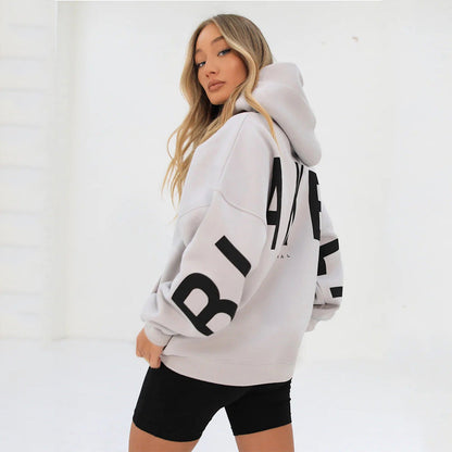 Lovéa - Oversize Kapuzenpullover für Frauen mit auffälligem Textdruck