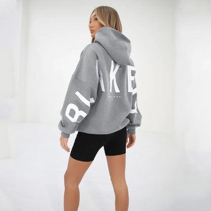 Lovéa - Oversize Kapuzenpullover für Frauen mit auffälligem Textdruck